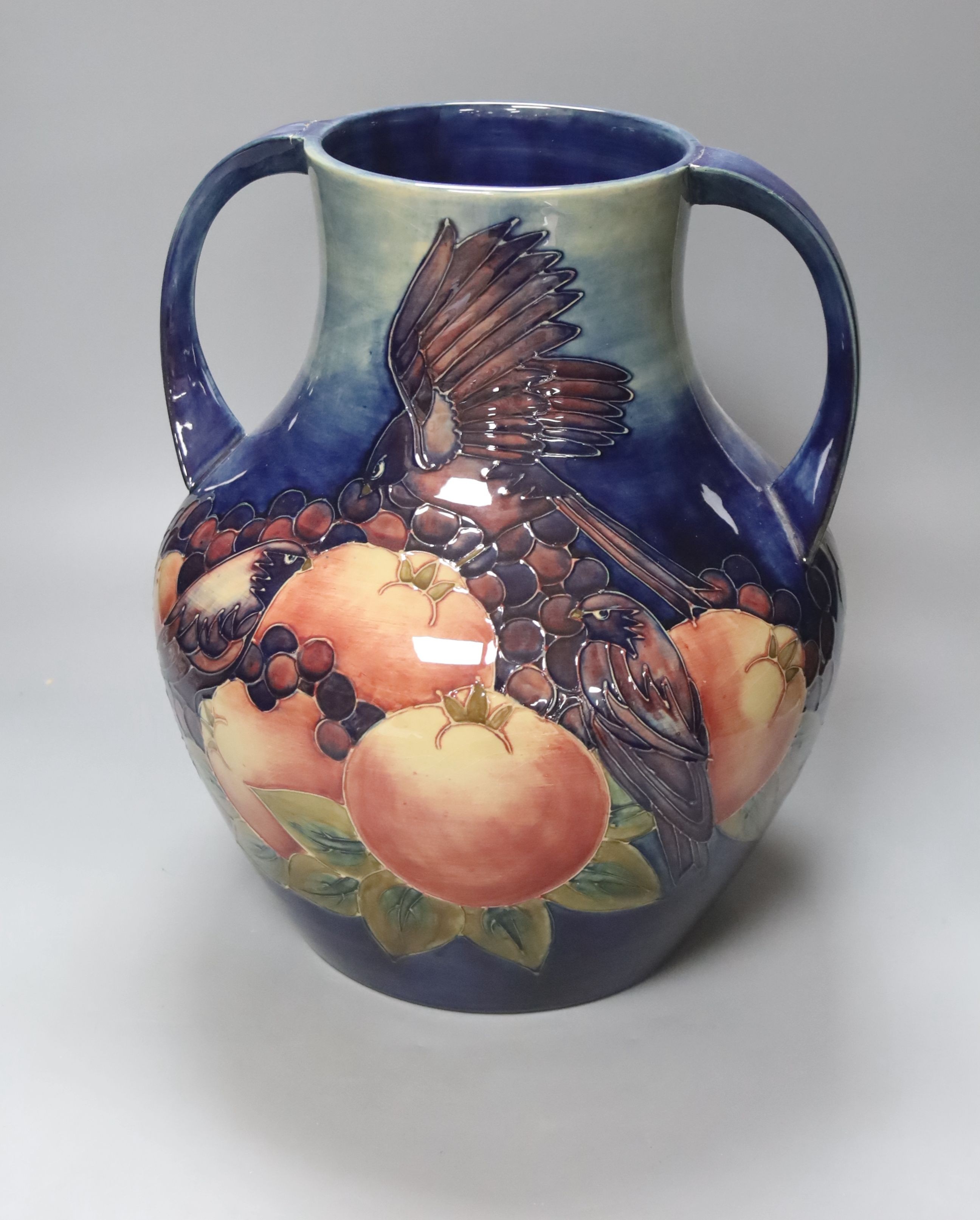 A large Moorcroft finches and fruit two handled vase, height 36cm